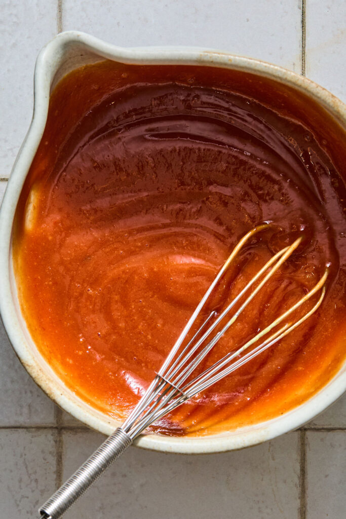 Sauce ingredients whisked together in a bowl.