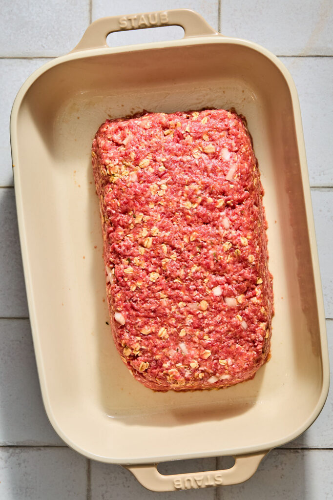 Meatloaf with Oats in a pan before being baked.