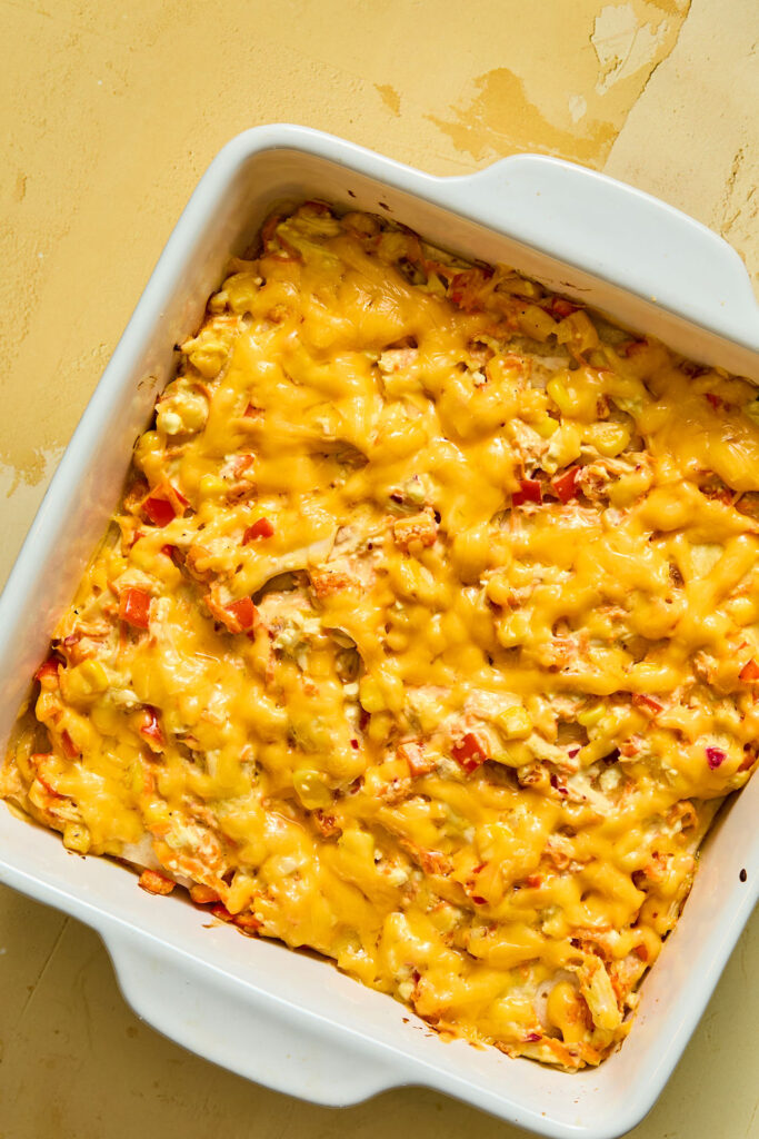 Honey Mustard Chicken Enchilada Casserole in a baking dish after being baked.